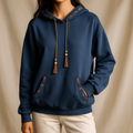 Ingrid - Sudadera con capucha y borlas